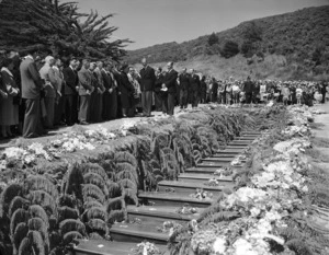 His Royal Highness Prince Philip, Duke of Edinburgh, attending the Tangiwai Railway disaster funerals as 21 coffins of unidentified victims await burial