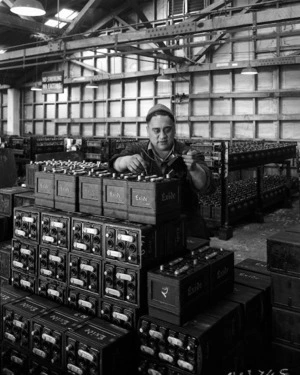 George Taki checking batteries, at the Exide Battery Works in the Hutt Valley