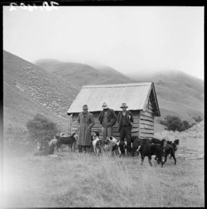 Musterers and their dogs in front of a hut, Orari Gorge Station