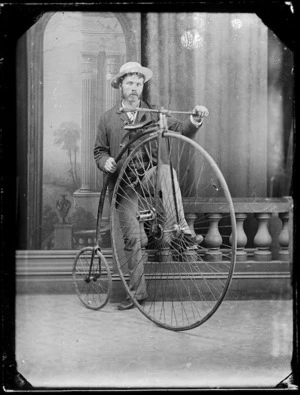 Man with a penny farthing bicycle