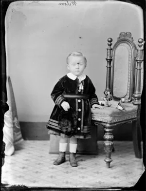 Toddler of the Wilson family, with a toy