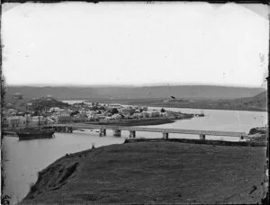 Taupo Quay, looking across the river with bridge, quay and stockade, Whanganui