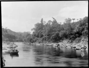 Unidentified man in a dingy on a tributary of the Whanganui River