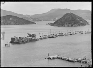 View of Otago Harbour with Goat Island and pumping equipment on pontoons in the centre, 1926