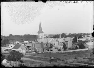 View towards Victoria Street, Wanganui, showing the back of St Mary's Catholic Church and the premises of T Woolley