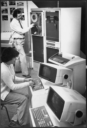 Carol Canvin and Paul Anderson, of Data General New Zealand Ltd, operating computers at the Am-Tech business machines exhibition in Wellington - Photograph taken by Ian Mackley