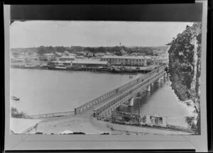Bridge across Whanganui River looking toward the wharf area with two steamers berthed