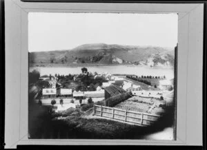 View from Rutland Stockade, Wanganui, of a vegetable garden and houses with the river behind