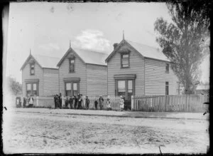 Houses in Wanganui, children alongside