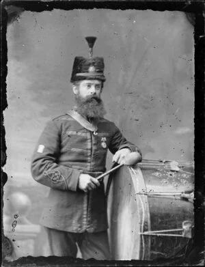 Unnamed bandsman, in uniform of Wanganui Rifle Volunteers, with bass drum
