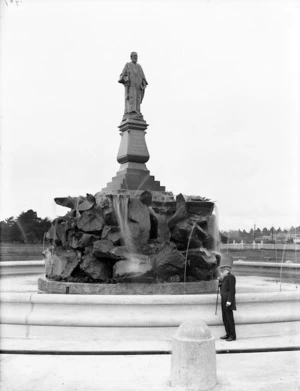 John Logan Campbell standing in front of a statue of himself, Cornwall Park, Auckland