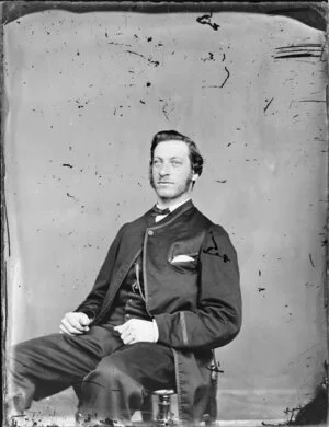 Unidentified man, seated