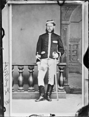 Mr E Locket, in uniform and with sabre