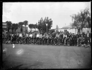 Row of boys on bicycles