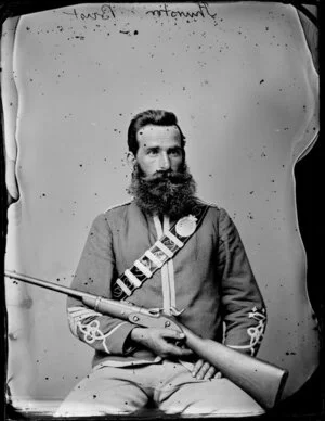 Mr Thurston, in uniform with rifle