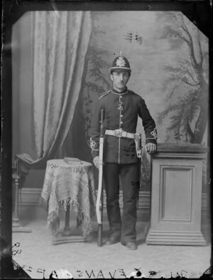 Mr Evans, in uniform with musket and peaked helmet and short sword