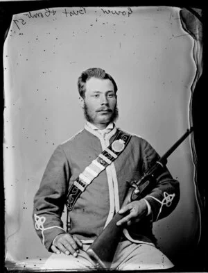 Mr Alfred Gower, in uniform and with rifle