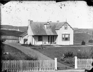 Two-storied house with front verandah, fence and gate, Wanganui