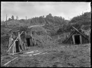 Three food storage pits for storing kumara, at Ruatahuna, 1930.