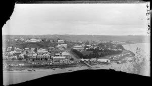 Taupo Quay, Market Place and Moutoa Gardens, Wanganui, with many waka pulled up on the shores of the river adjacent to a tent settlement