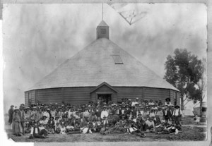 Maori group outside the round meeting house at Mohaka