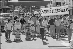 Demonstrators with banners, during a march protesting against the closure of Elderslea Maternity Hospital in Upper Hutt - Photograph taken by Ray Pigney