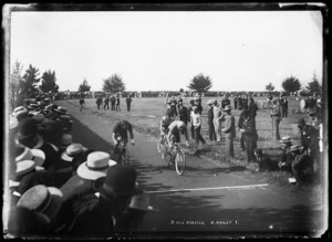 Richard Arnst leading a group of cyclists to the finish line in a two mile scratch race