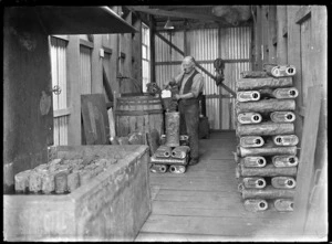 Unidentified railway employee working in the "footwarmer house" at the Hillside Railway Workshops, Dunedin, 1926