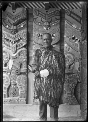 Chief Whatanui standing inside the porch at Hinenuitepo meeting house at Te Whaiti, 1930