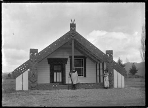 Chief Matekuare and his daughter Tuki outside a meeting house at Te Whaiti, 1930