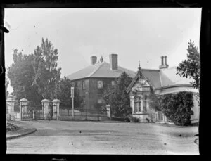 Houses and wrought-iron fence and gate [leading to Albert Park?] Auckland