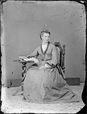 Miss Coombes, seated