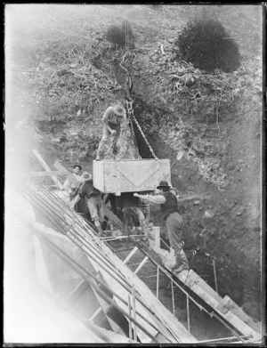 Men working on the Wainuiomata Reservoir