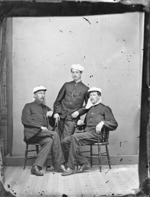 Three men in military uniforms
