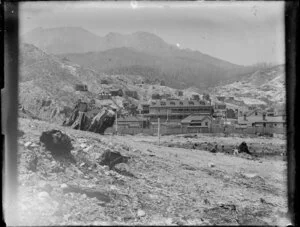 Settlement with W J Cowen Imperial Hotel set amongst denuded hills, [Queenstown, Tasmania?]