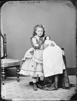 Girl from Evan family, aged 6 holding a doll - Photograph taken by Thompson & Daley of Wanganui