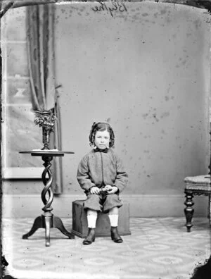 Blythe toddler sitting on a small box