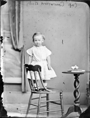 Captain Cameron's toddler standing on a chair