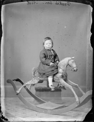 Noel Do, aged 2, on rocking horse