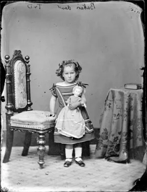 Miss Baker, aged 3 with doll - Photograph taken by Thompson and Daley of Wanganui