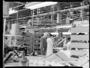 Queen Elizabeth II watching a fabric worker in the Ford Motor Company factory, Lower Hutt, Royal Tour 1953-1954