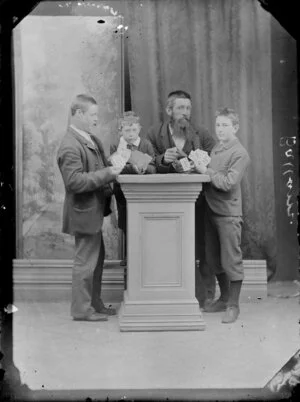 Unidentified men and boys, playing cards