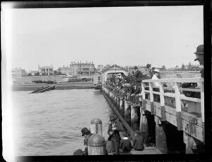 Group fishing on wharf, St Kilda, Melbourne