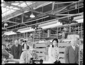 Queen Elizabeth II and the Duke of Edinburgh watch machinists at work in the Ford Motor Company factory, Lower Hutt, Royal Tour 1953-1954
