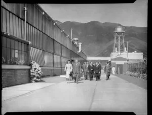 Queen Elizabeth II with officials walking through the grounds of the Ford Motor Company, Lower Hutt, Royal Tour 1953-1954