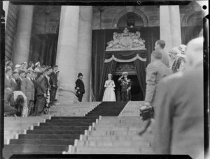 Queen Elizabeth II and the Duke of Edinburgh standing on Parliament Building steps at the opening of Parliament, Royal Tour 1953-1954