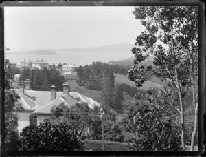 View of Waitemata Harbour from Hobson Bay area, Auckland, featuring large, two-storied houses, and trees