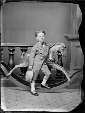 Tingey (Shaw), boy aged 4, by rocking horse