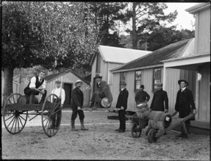 Group of men and beer barrels outside the Oaks Hotel, Mangonui
