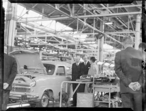 The Duke of Edinburgh inspecting a car at the Ford Motor Company factory, Lower Hutt, Royal Tour, 1953-1954
